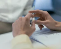 hands over signed document