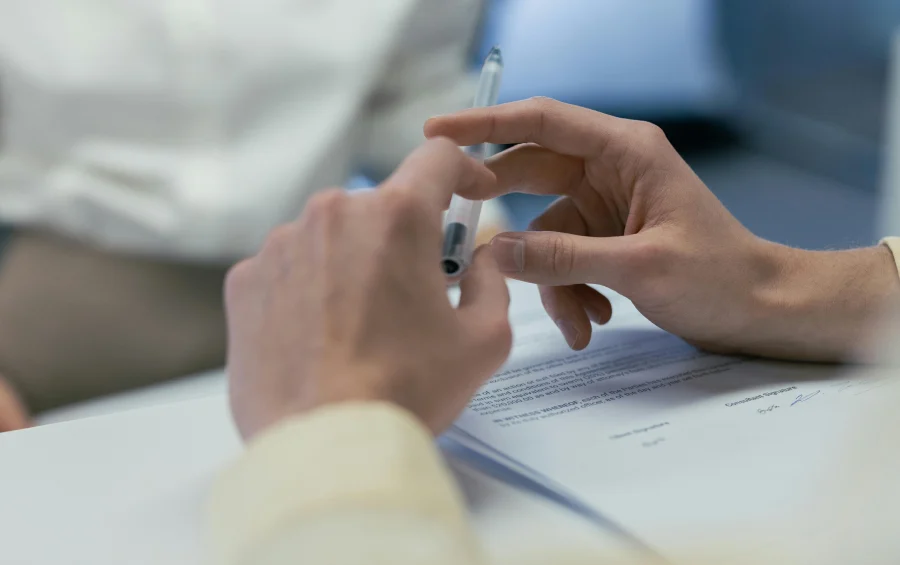 hands over signed document